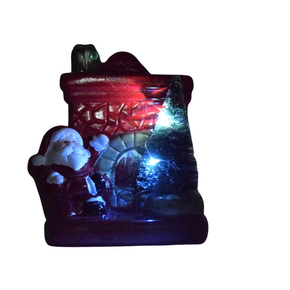 Santa Claus by the Fireplace Christmas Figurine
