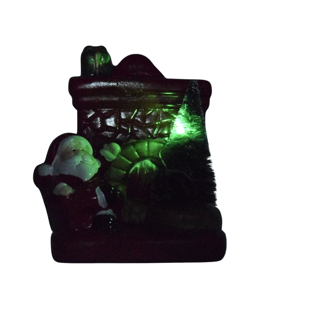 Santa Claus by the Fireplace Christmas Figurine