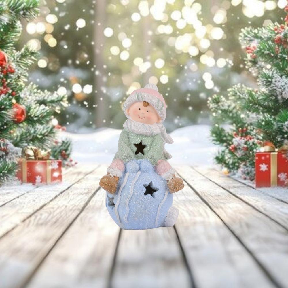 Winter Child Figurine with Star Cut-Out Lantern